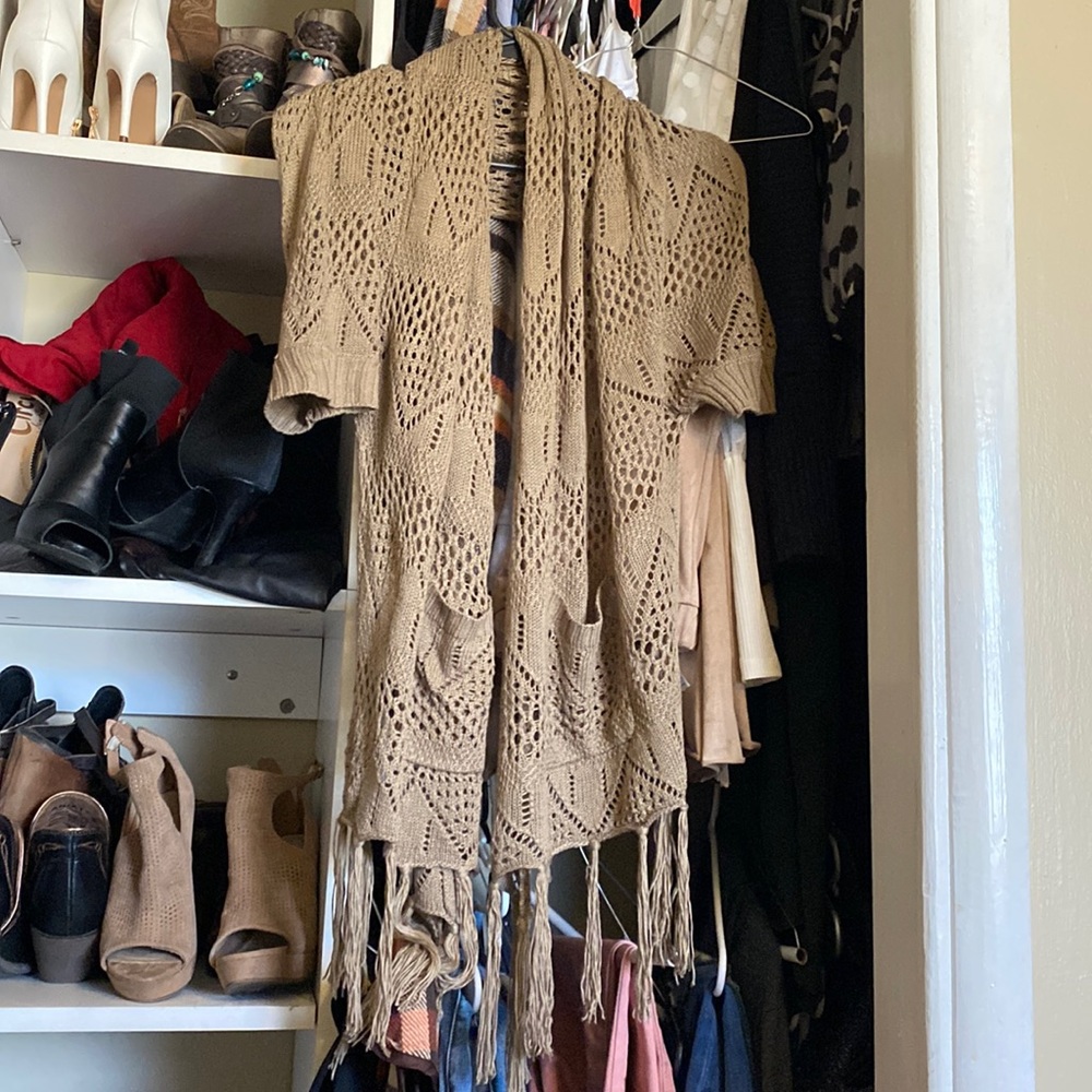 Size m/L made by miracle city. Tan crocheted shawl with pockets and sleeves